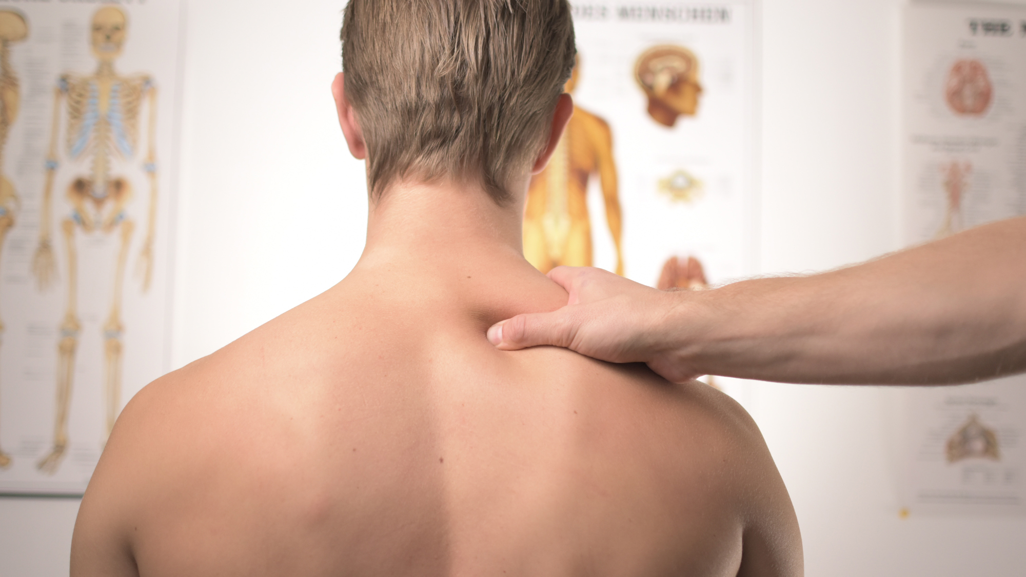Therapist working on a client's back during a deep tissue massage